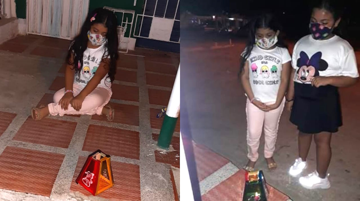 Valerie Ramírez y Sofía Jiménez, frente a las velitas en la Ciudadela Metropolitana.