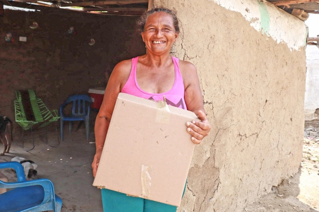 Beneficiaria de la entrega de los alimentos.