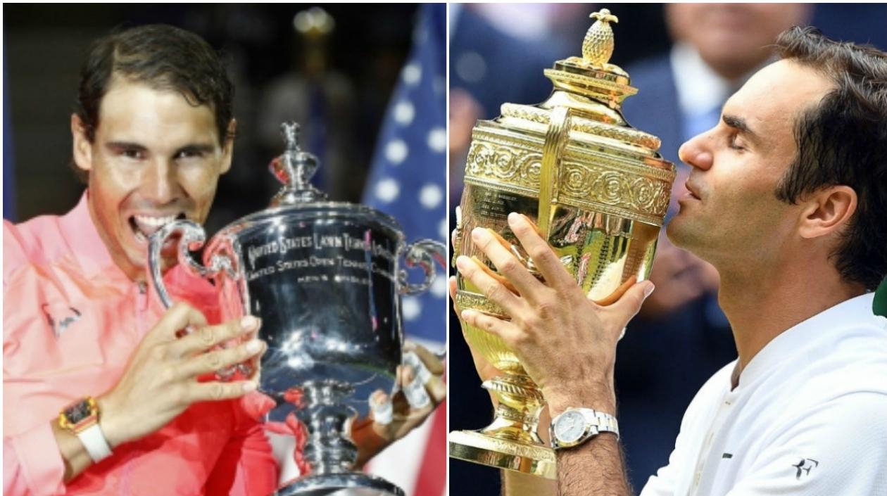 Nadal con el trofeo del US Open y Federer con el de Wimbledon.