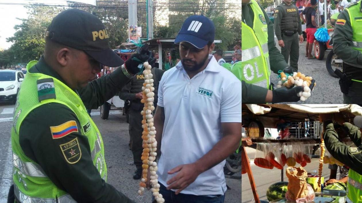 La Policía y Barranquilla Verde hicieron los operativos de decomiso de las iguanas. En la foto, un policía y un veterinario.