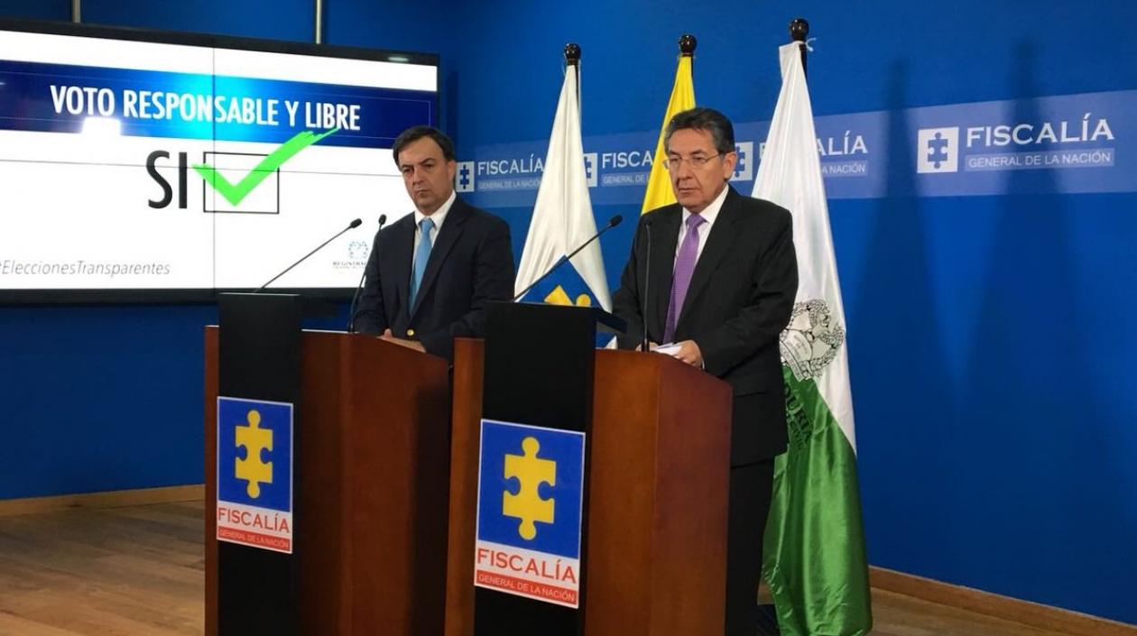 El registrador Juan Carlos Galindo y el fiscal Néstor Humberto Martínez.