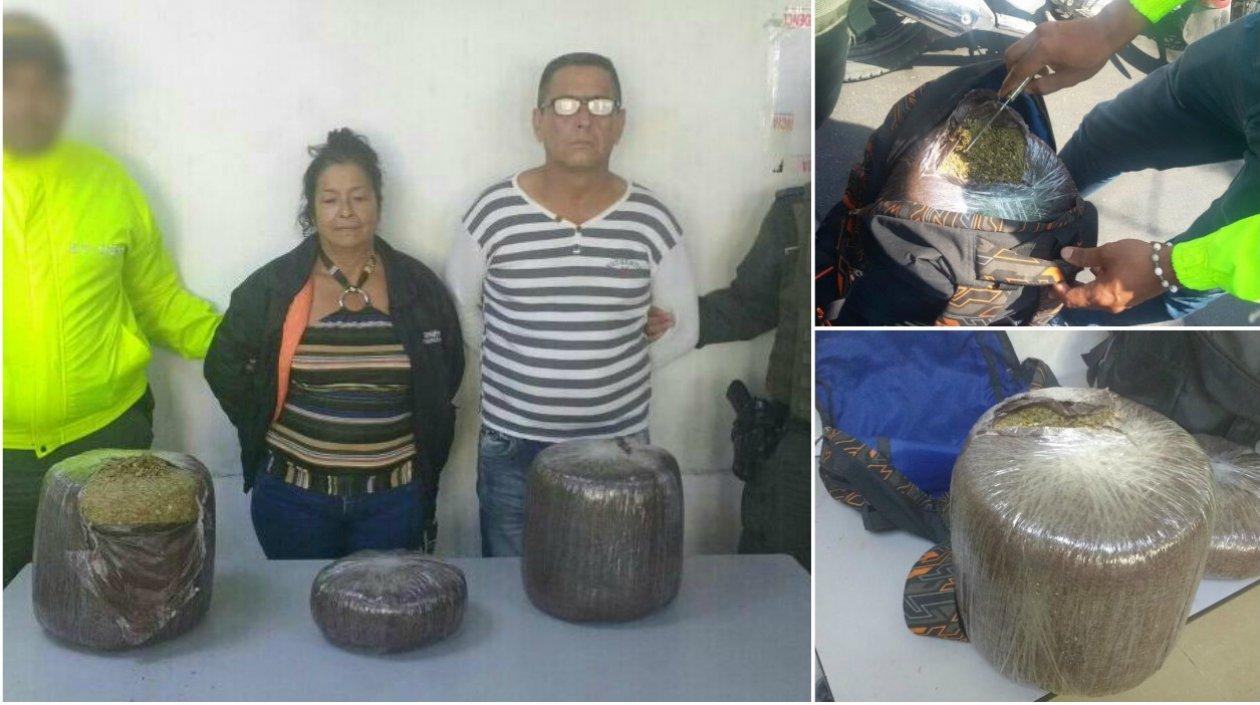 Los capturados y la marihuana incautada.