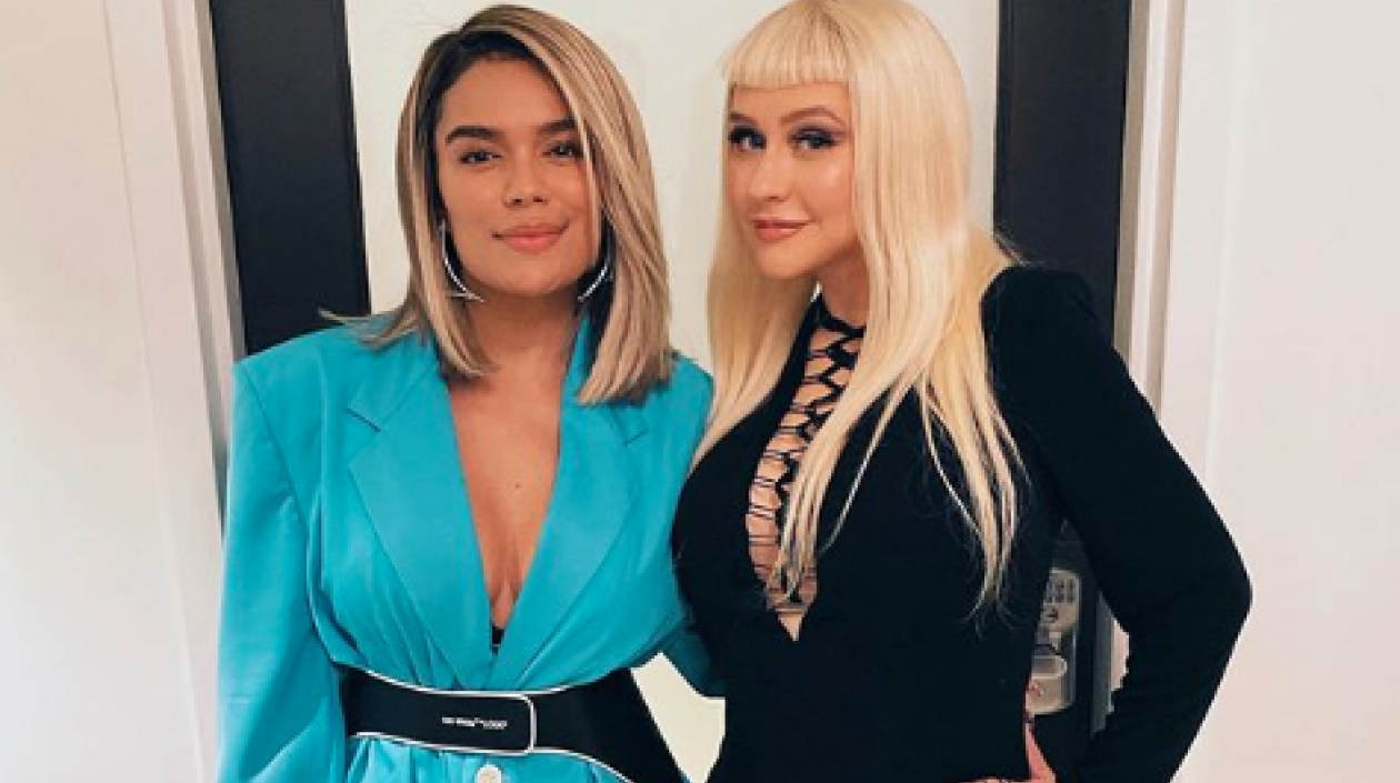 Las cantantes Karol G y Christina Aguilera.