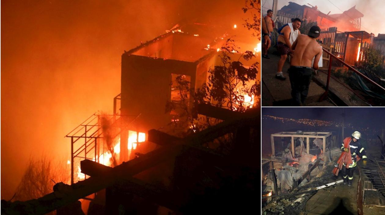 Varias personas intentan sofocar las llamas en sus viviendas que se han visto afectadas por un incendio forestal que alcanzó ayer en Valparaíso.