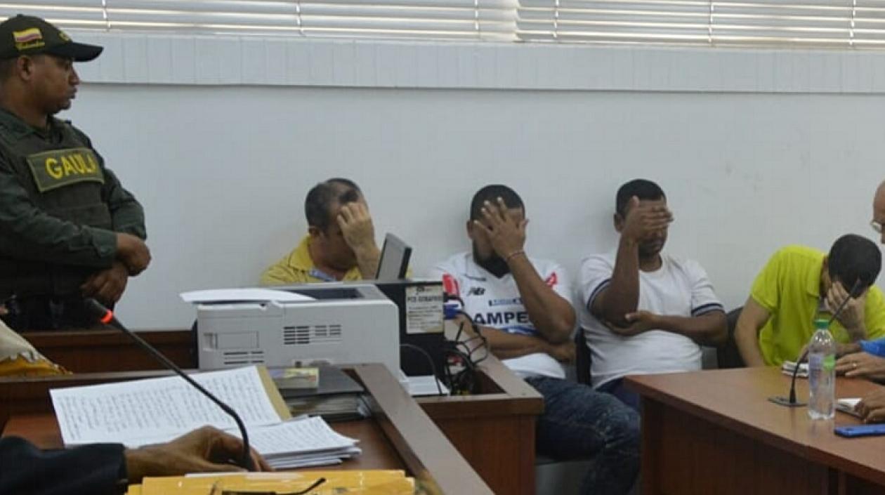 Los cuatro capturados.