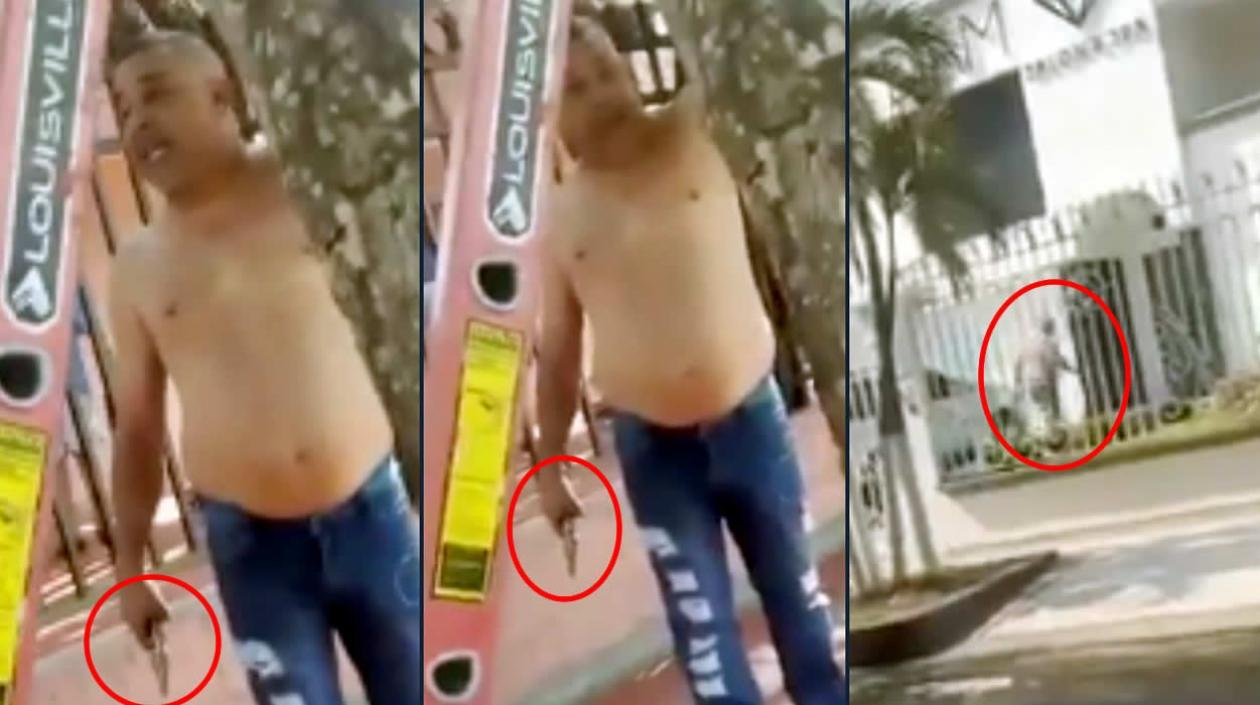 El usuario, con revólver en mano, amenazando a la cuadrilla y luego ingresando al establecimiento comercial.