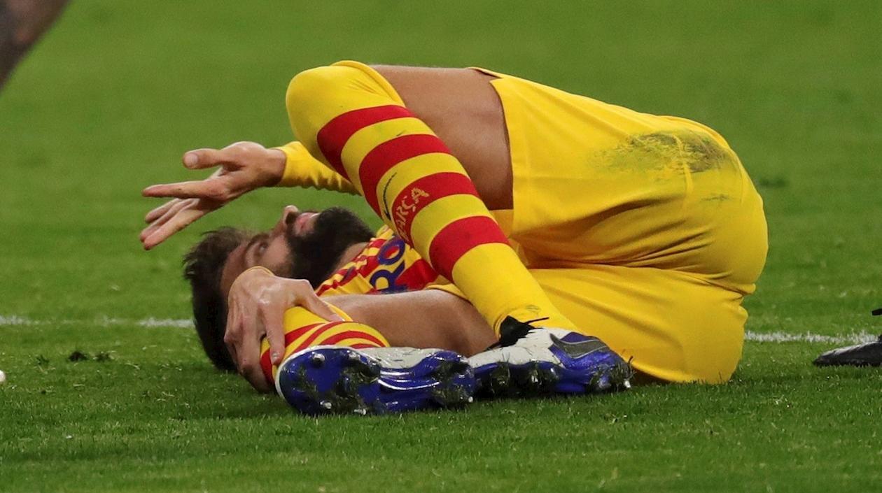 Gerard Piqué en el momento de su lesión. 