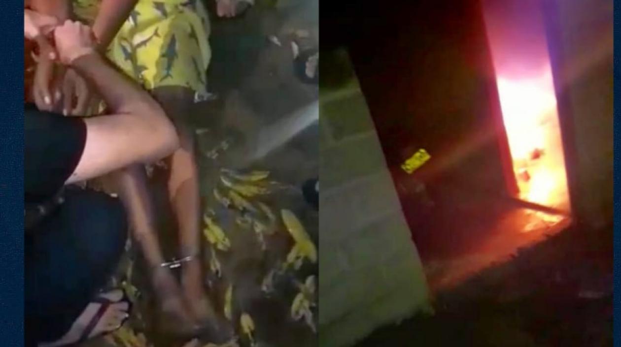 El hombre cuando era auxiliado por vecinos con la habitación incendiada.