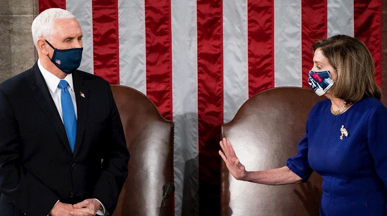 El vicepresidente Mike Pence y Nancy Pelosi.