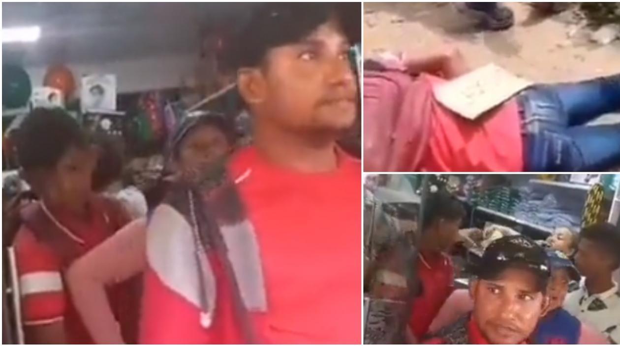 El niño y el joven son sacados con las manos amarradas por una mujer.