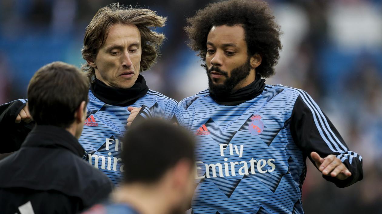El croata Luka Modric y el brasileño Marcelo Vieira.