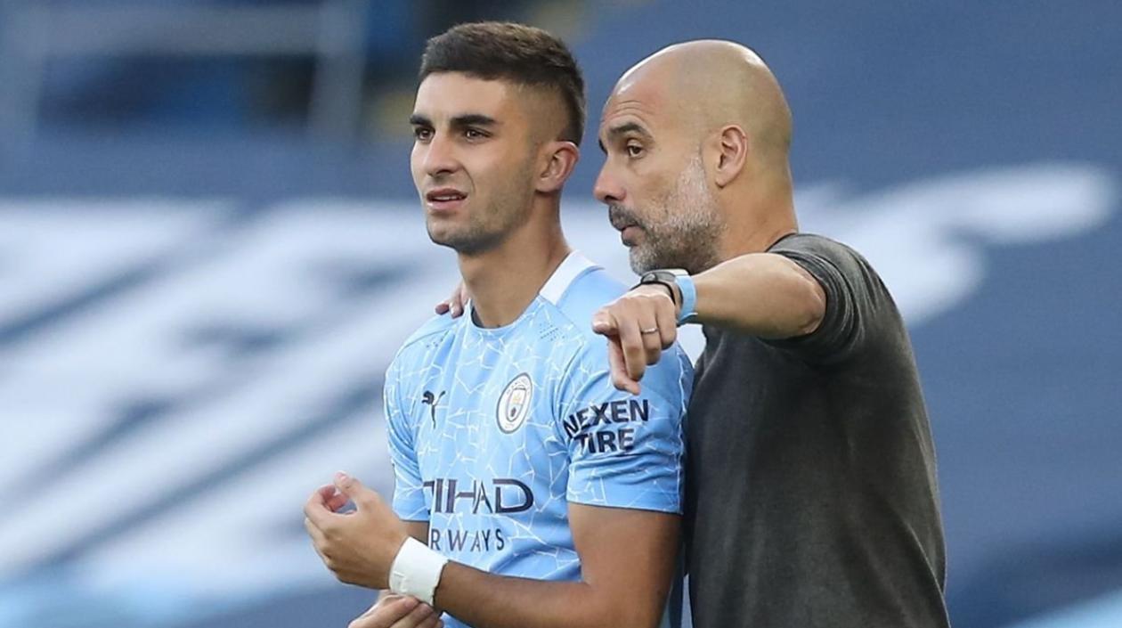 Ferran Torres y Pep Guardiola.