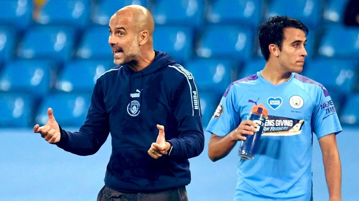 Pep Guardiola y Eric García.