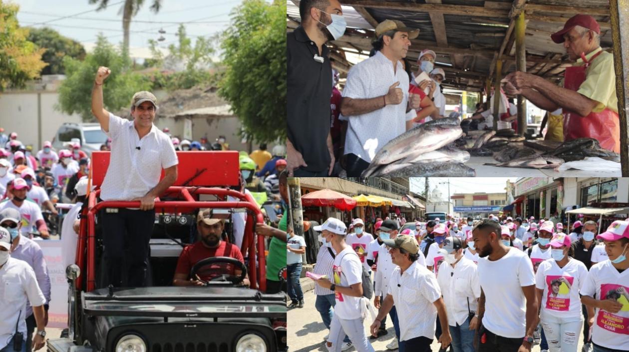El candidato presidencial Alex Char, a la derecha camina por Soledad con el medallista Anthony Zambrano.