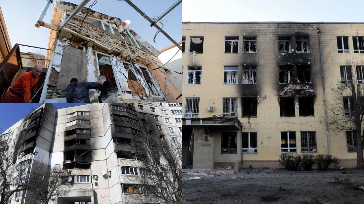 Varias personas tratan de arreglar los daños de varios proyectiles en una zona residencial de Odesa (Ucrania). 