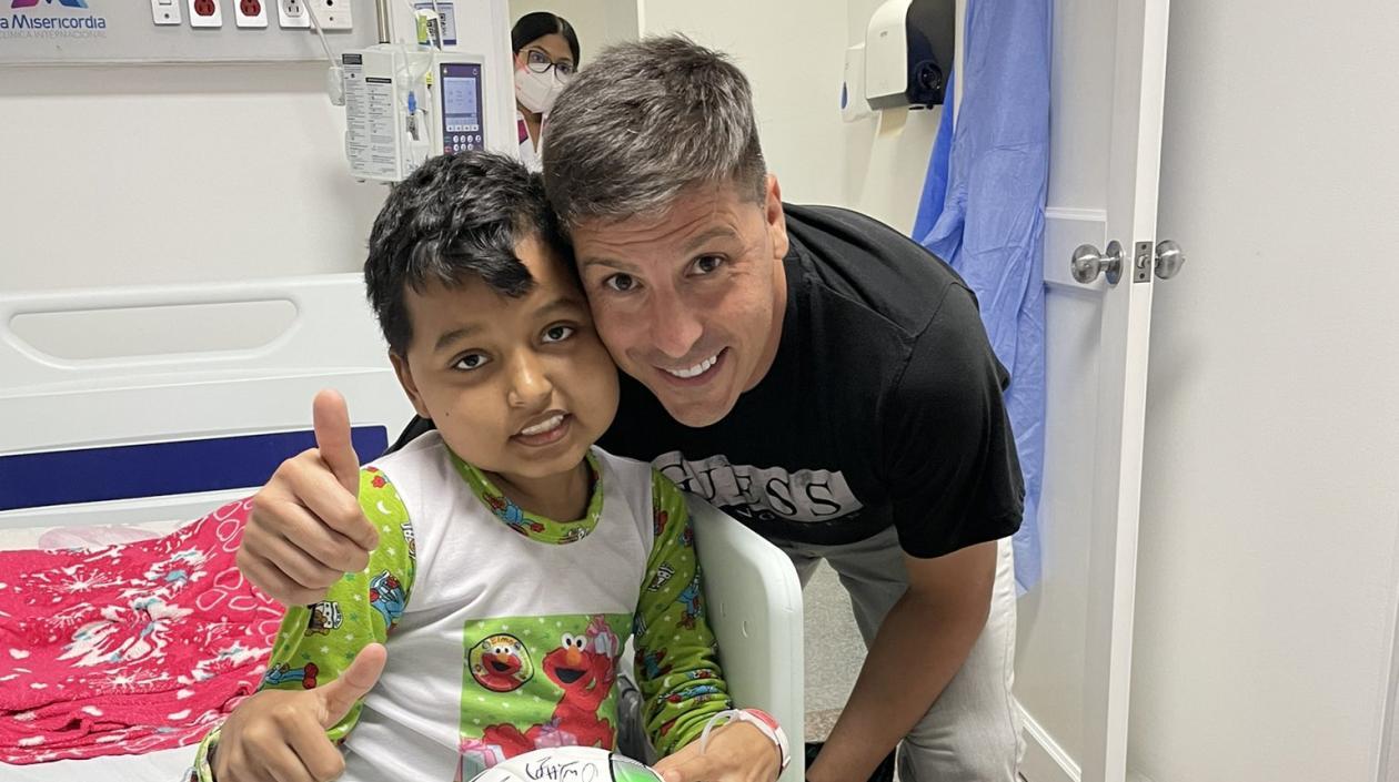 Jadier Ariel y Juan Cruz Real, entrenador de Junior. 