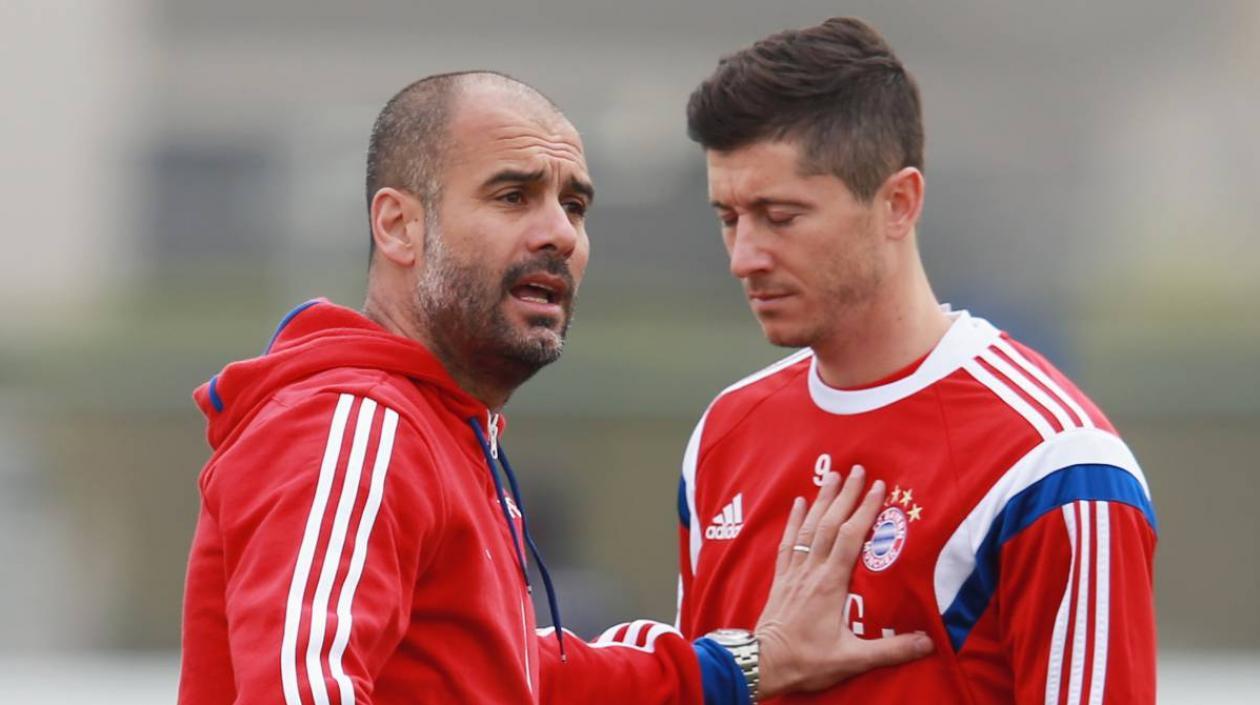 Pep Guardiola y Robert Lewandowski.