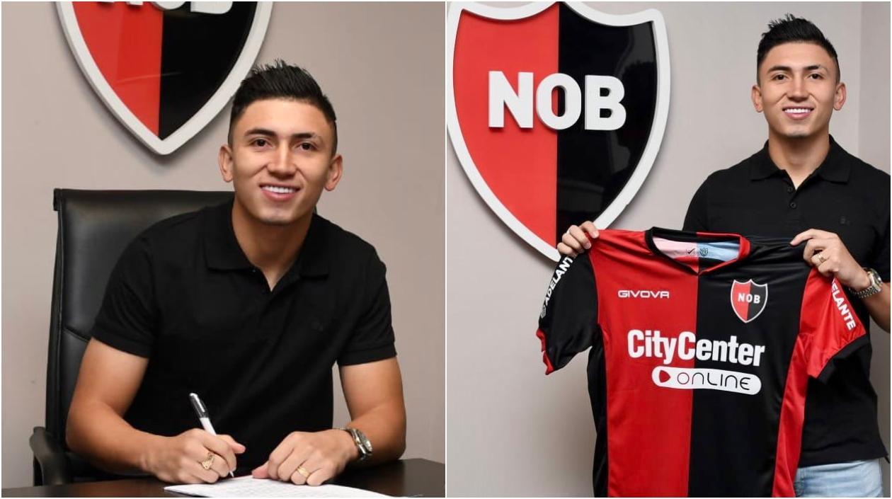 Fabián Ángel firma su contrato. 