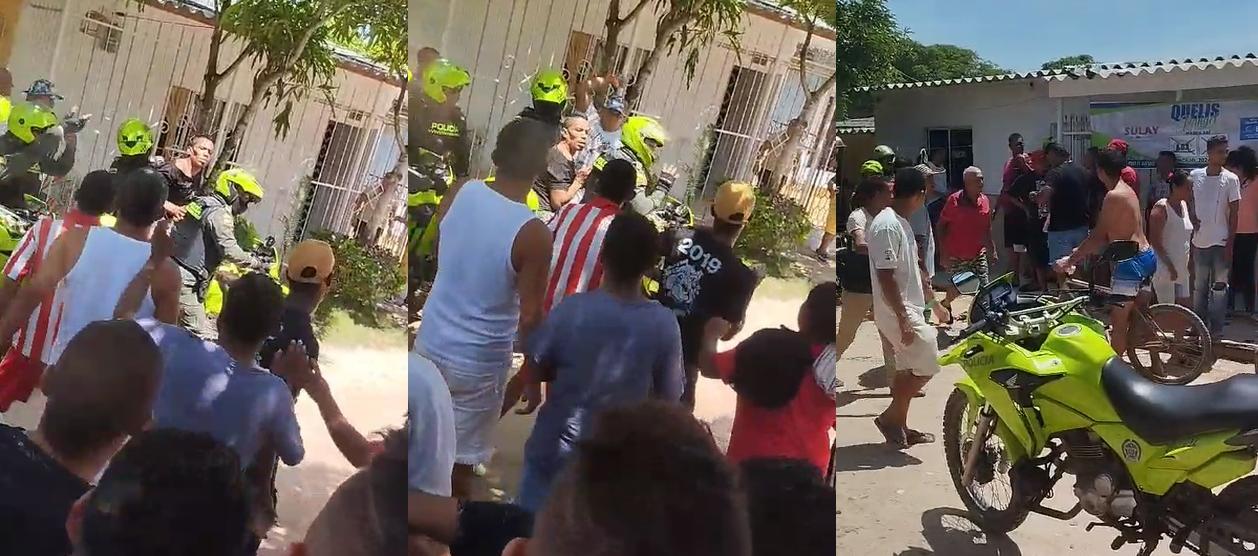 Policía intenta proteger a Enrique Jiménez de la comunidad.