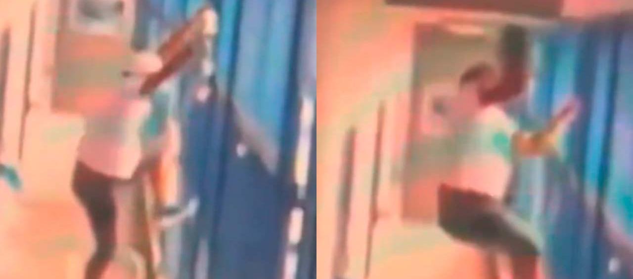 El 'Negro 'Ober' se alista para subirse por las rejas hasta el techo donde están las cámaras de seguridad