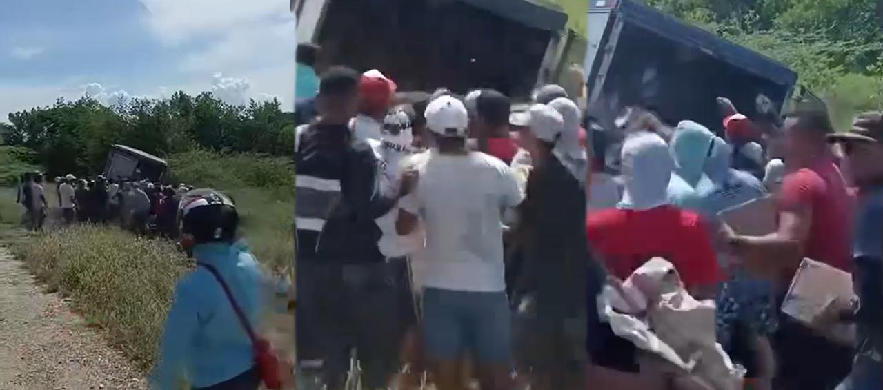 Momento en el que el camión es saqueado por varios habitantes.