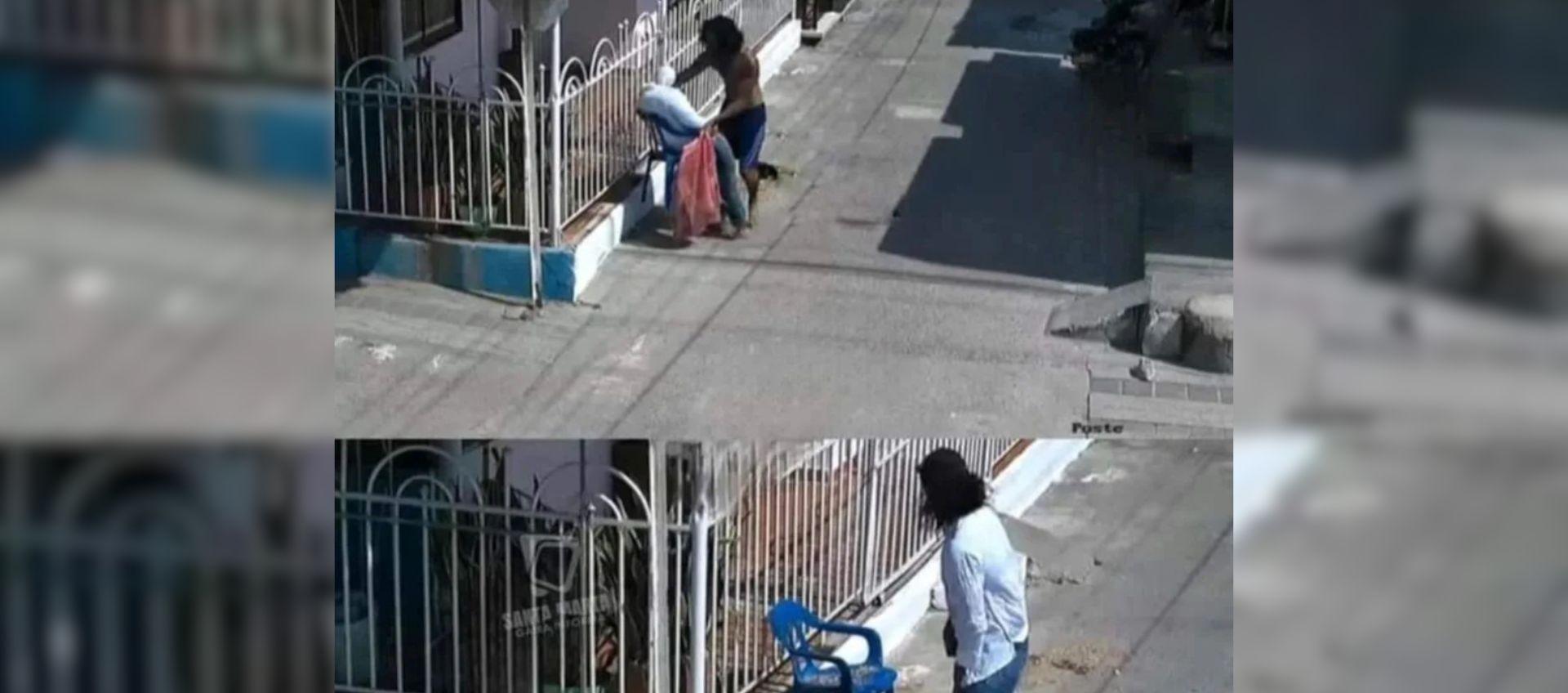 Hombre quitándole la ropa al muñeco.