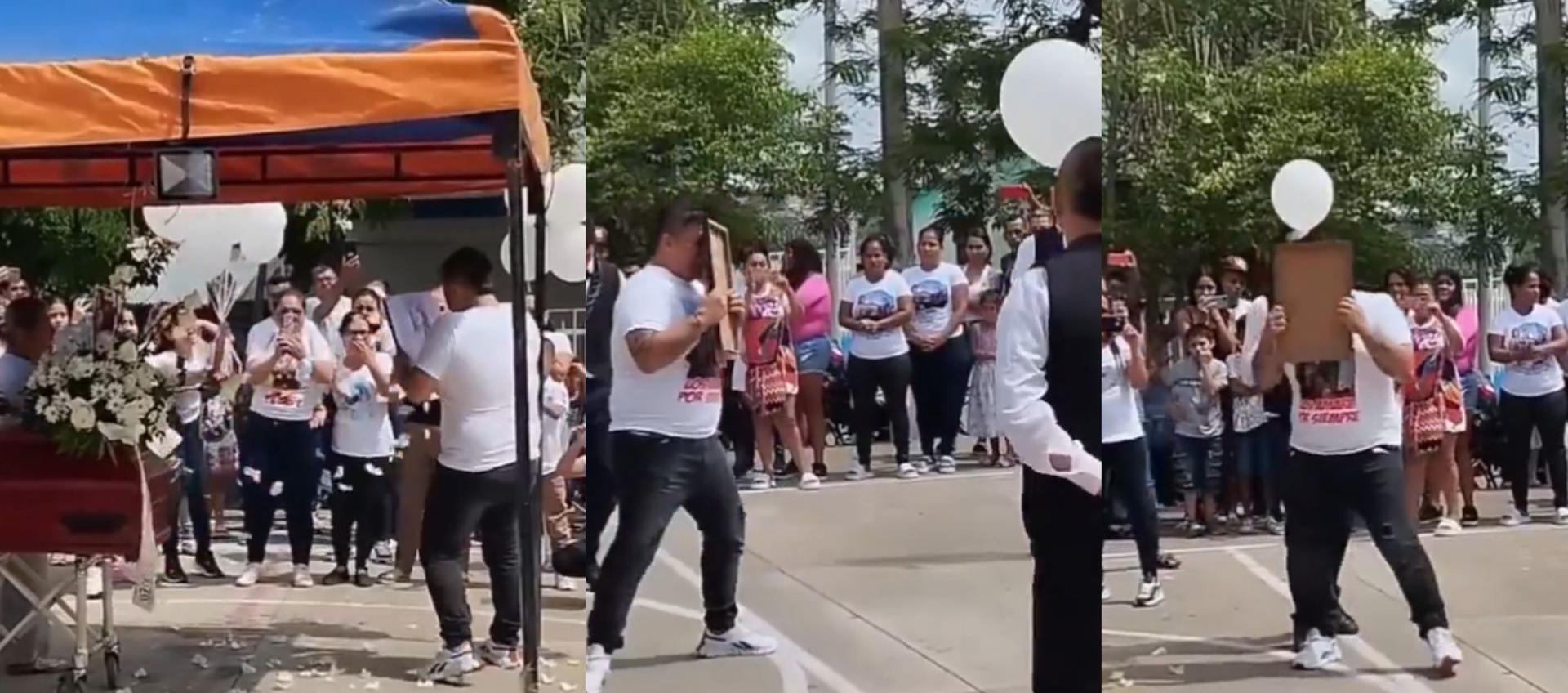 Padre bailando con retrato de su hija fallecida.