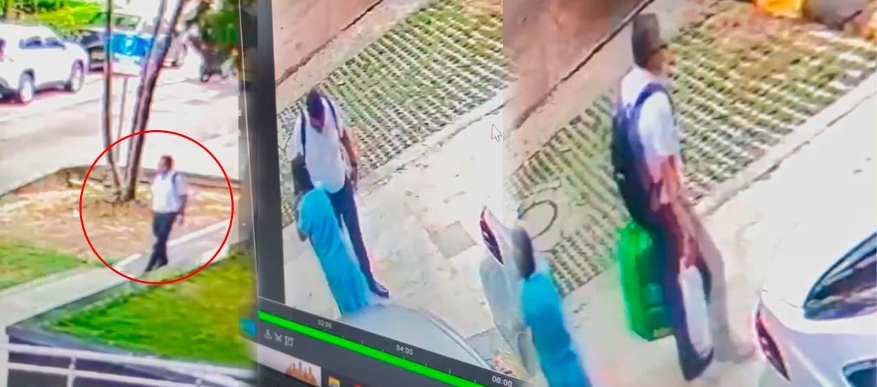 Uno de los ladrones cuando recibía la caja fuerte por parte de la empleada doméstica. 