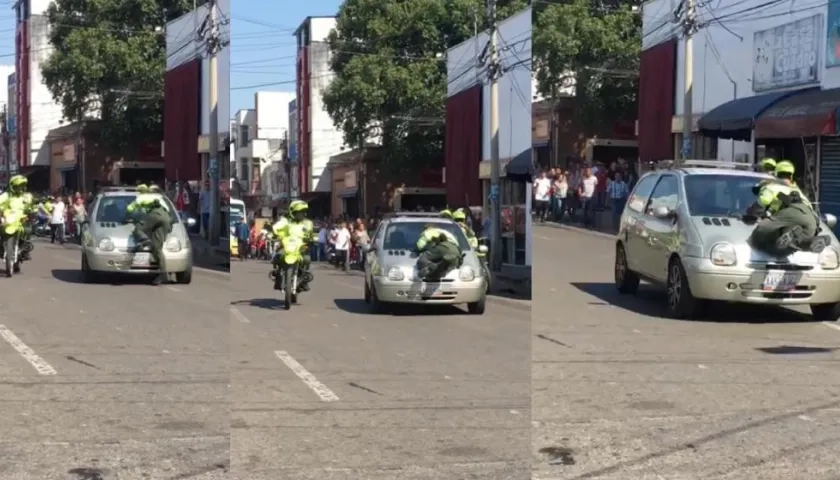 Aferrado en el capó el patrullero logró salvarse pese a que la conductora continuaba su marcha.