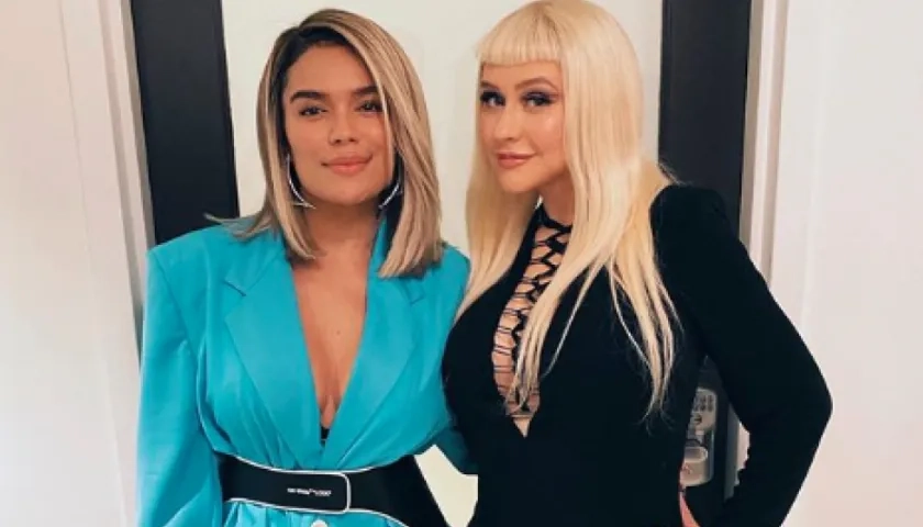 Las cantantes Karol G y Christina Aguilera.