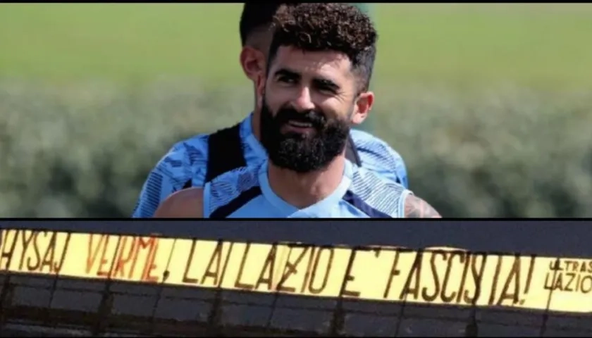Elseid Hysaj y la bandera que sacaron contra él los hinchas. 