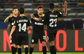 Jugadores del Pachuca celebran tras una anotación. 