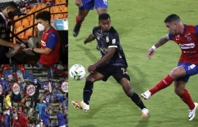 Hinchas en los estadios para ver jugar al DIM y a Águilas Doradas. A la derecha, Adrian Arregui (d) disputa el balón con Jesús Rivas (i). 