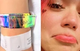 Brazo de la mujer que dio a luz y Karol G.