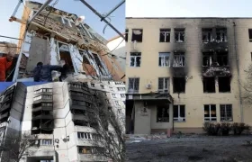 Varias personas tratan de arreglar los daños de varios proyectiles en una zona residencial de Odesa (Ucrania). 