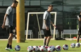 Sergio Busquets y Leo Messi.