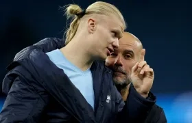 Erling Haaland y Pep Guardiola.