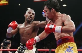 Mayweather y Pacquiao en su primera pelea, efectuada el 2 de mayo de 2015.