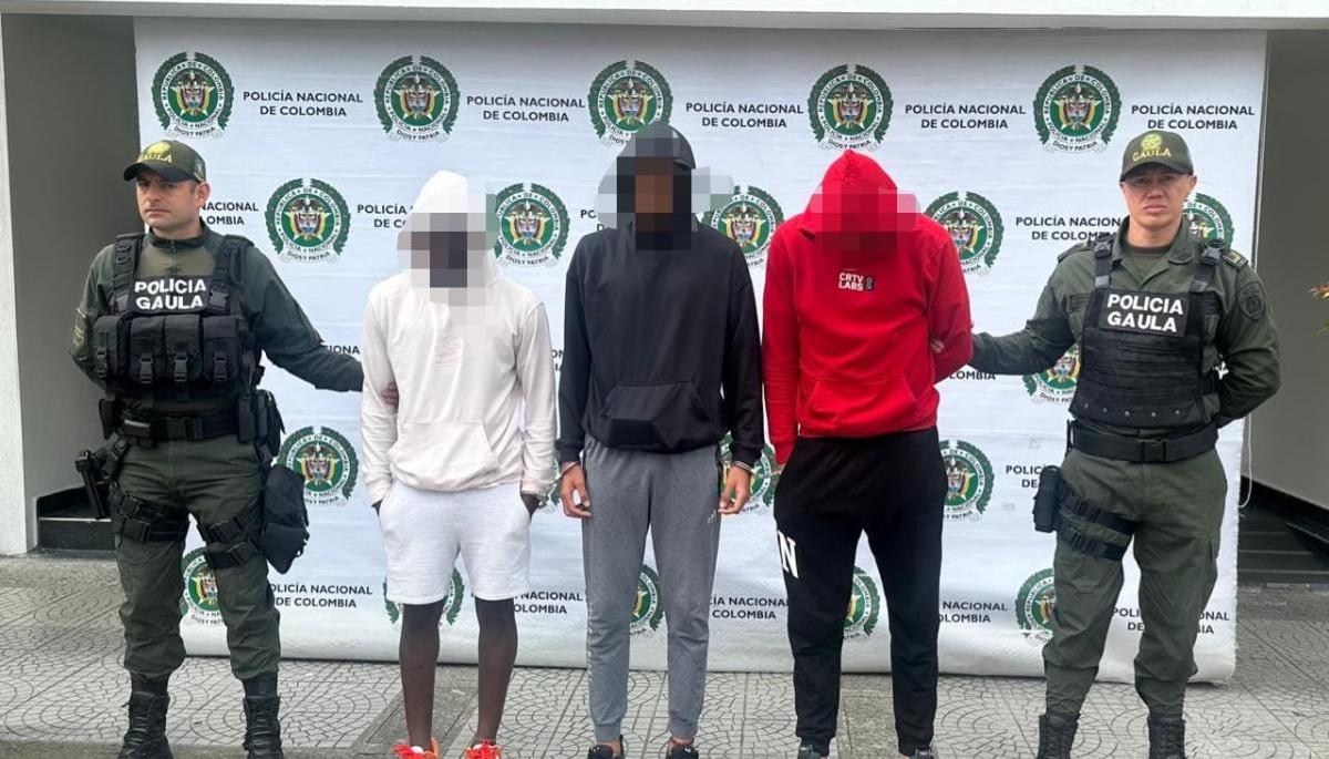 Los tres jugadores del Once Caldas tras ser capturados.  