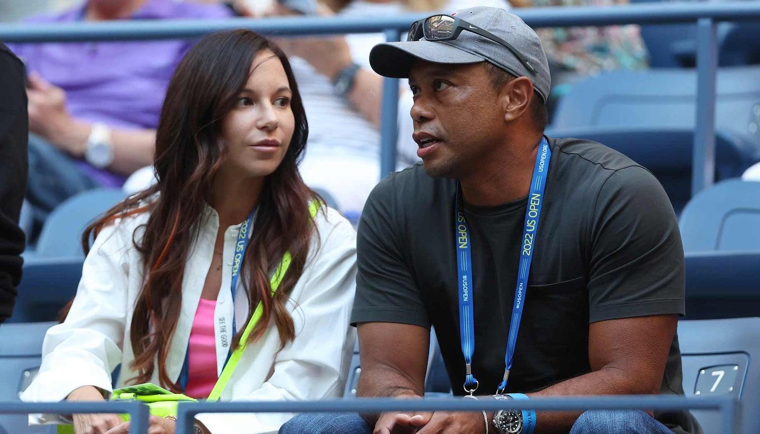 Erica Herman y Tiger Woods.