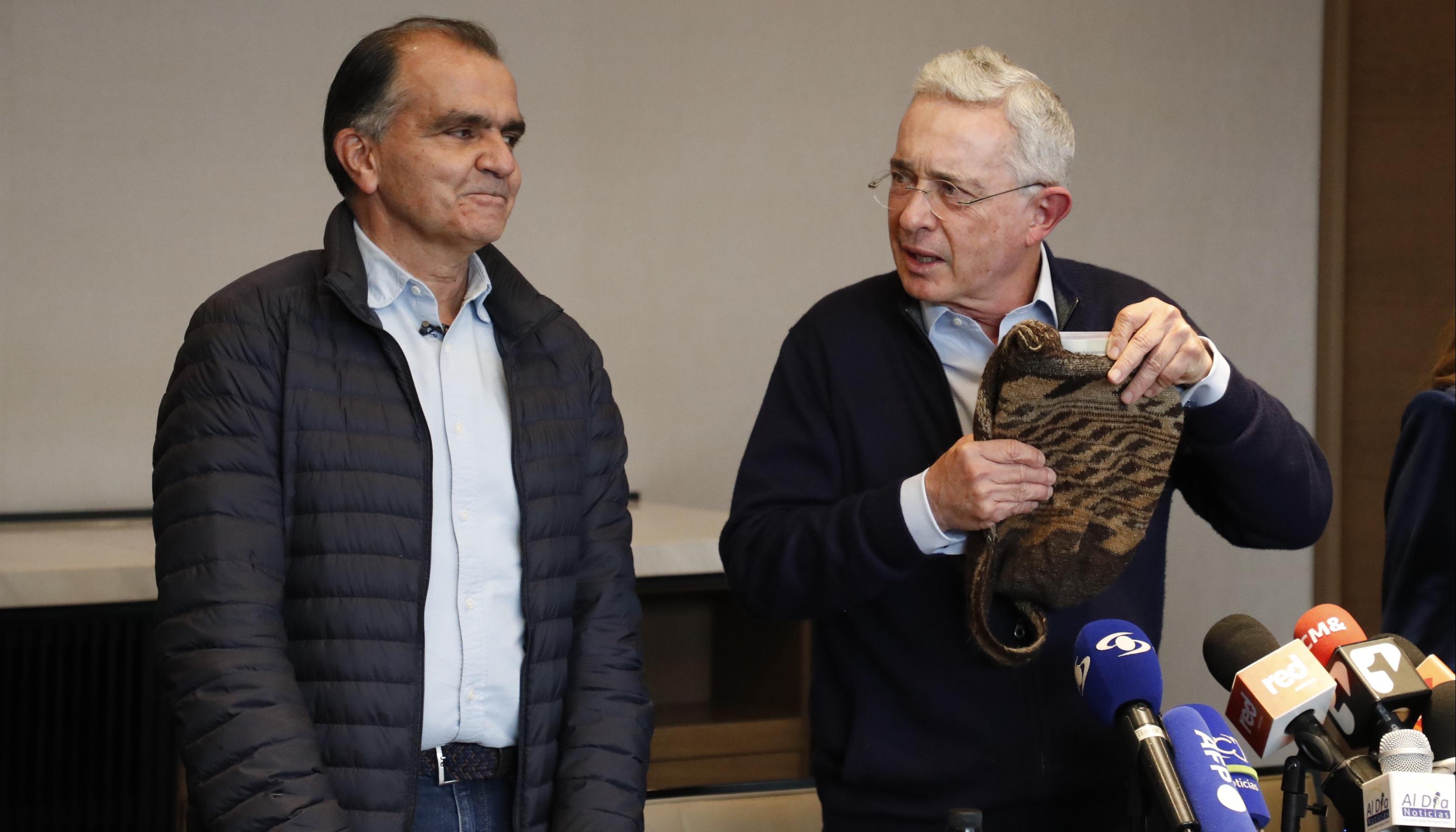 Óscar Iván Zuluaga y Álvaro Uribe Vélez.