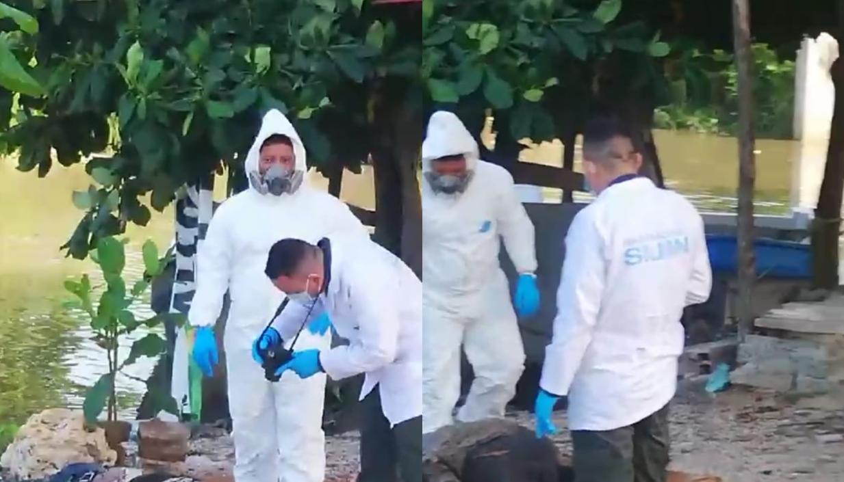 La Sijin realizando la inspección del cuerpo a orillas del río Magdalena. 
