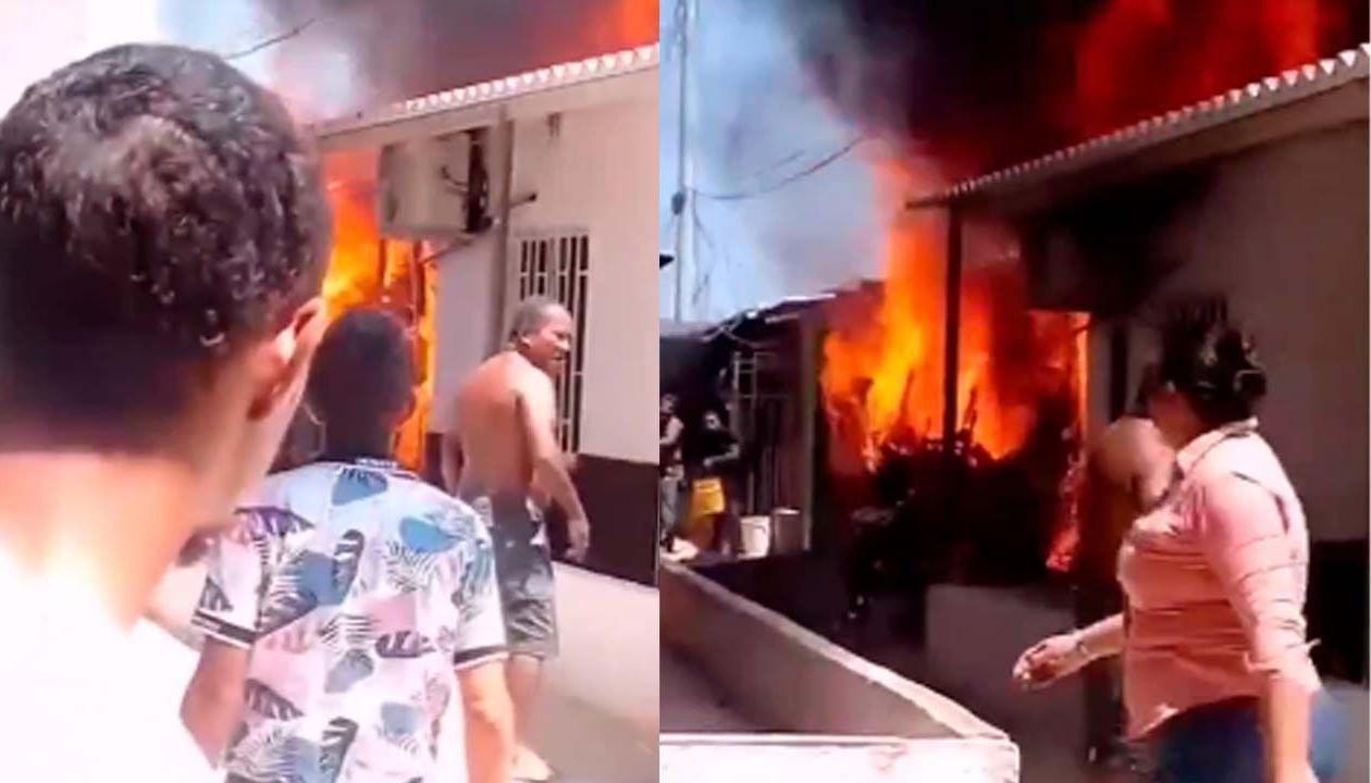Vecinos de San Vicente observan las llamas que salen de una vivienda en la calle 50C con carrera 2D