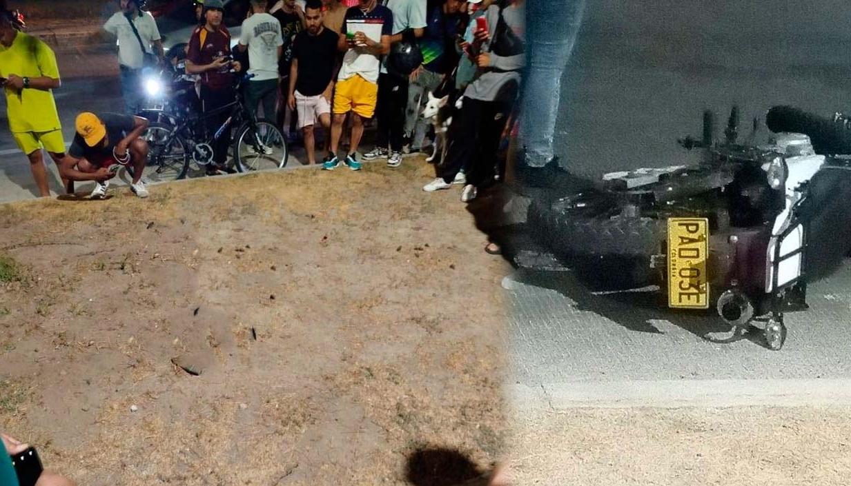 Curiosos en el sector donde cayó la persona acribillada y la moto en la que se desplazaba