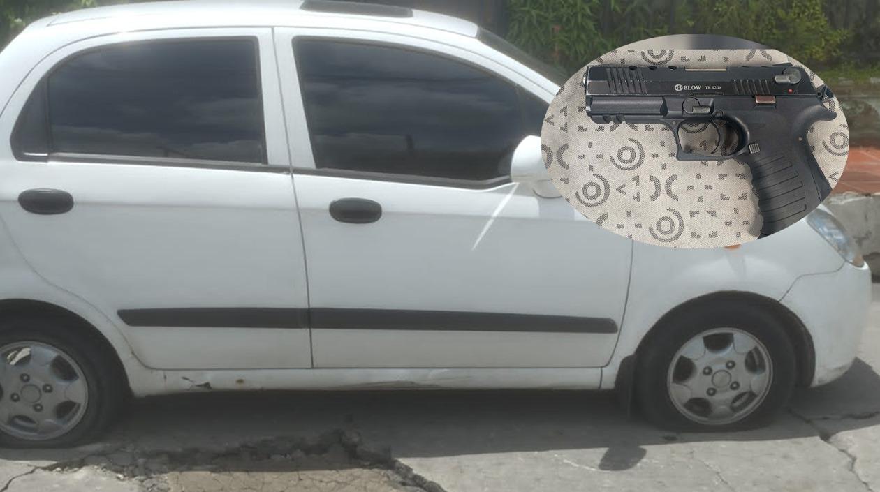 Vehículo y arma de fuego incautada. 