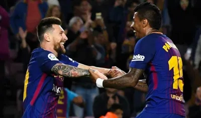 Lionel Messi y Paulinho. 