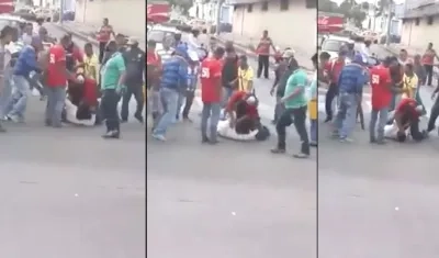 El delincuente cuando era objeto de la paliza tras hurtar el celular.