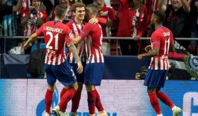 Antoine Griezmann celebrando uno de sus goles antes el Brujas.