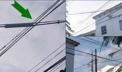 En las imágenes los cables de telefonía en medio de los de energía.