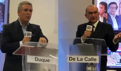 Iván Duque y Humberto De la Calle, interviniendo en el evento.